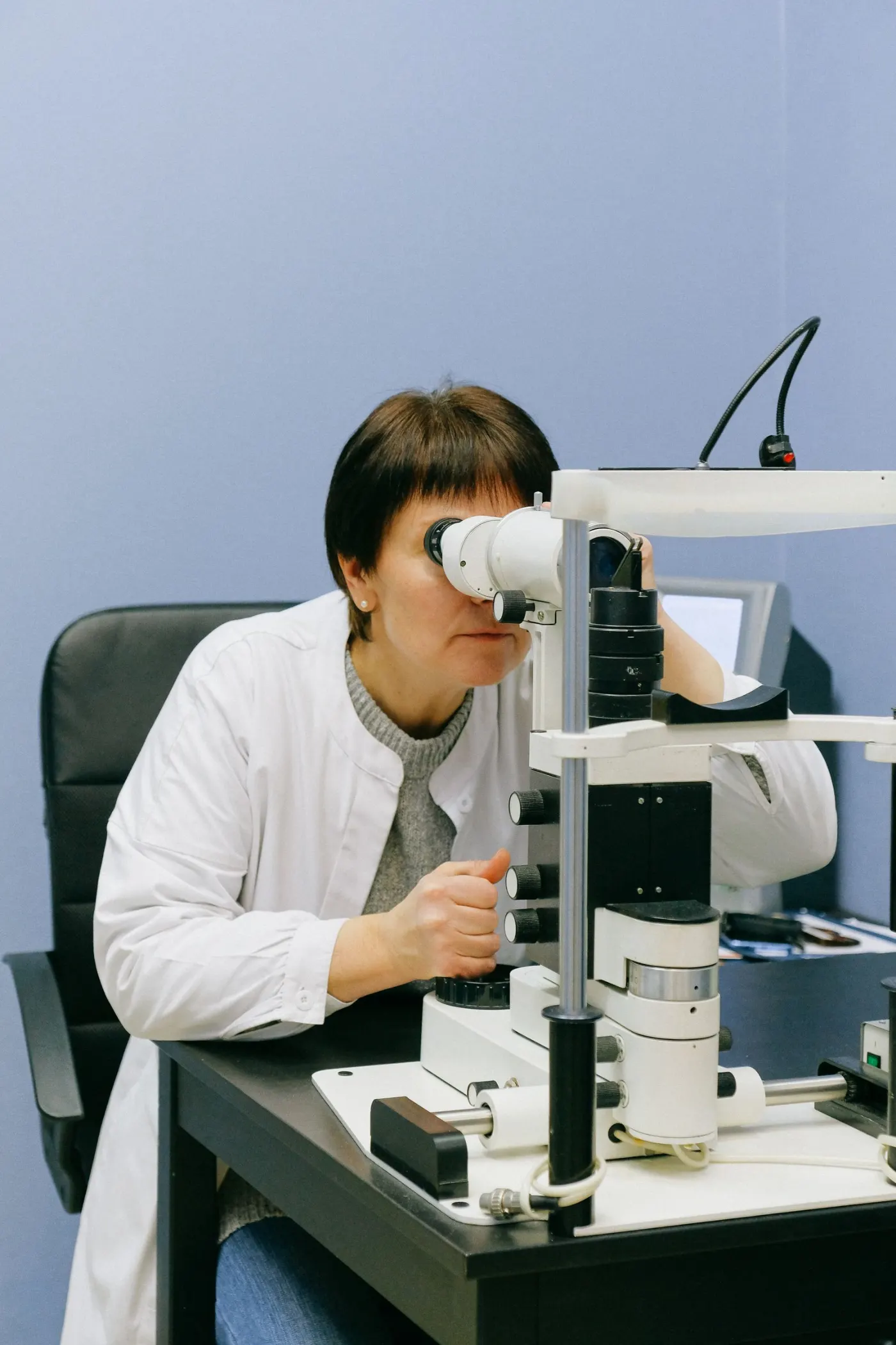 An ophthalmologist examining a patient's eye