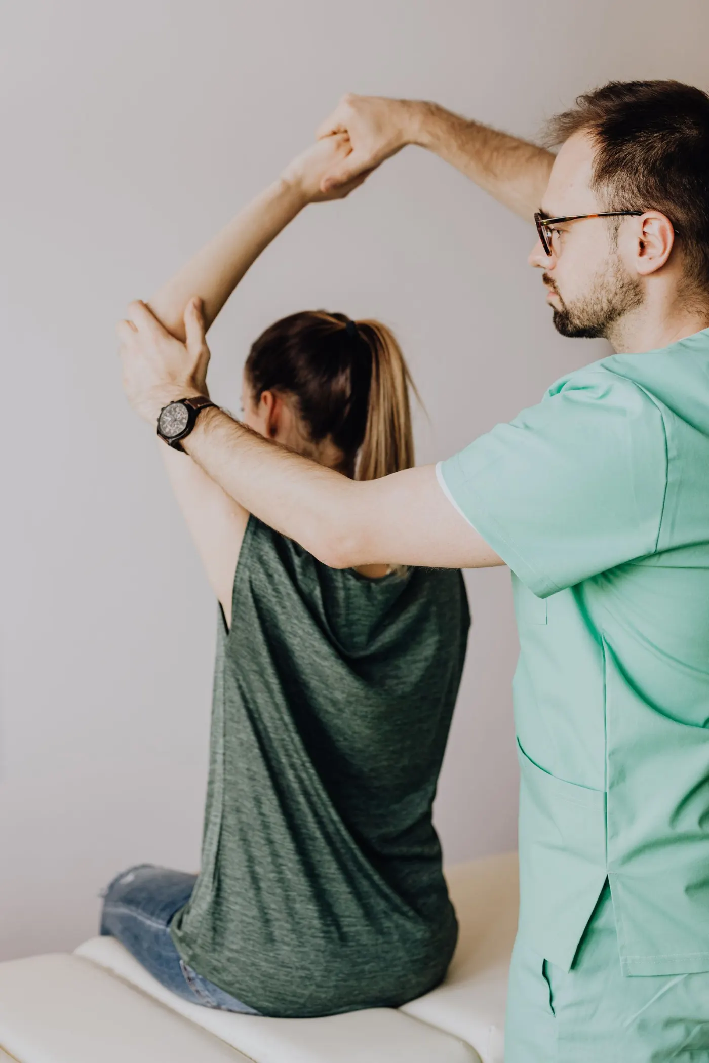 A clinician examining a patient's joint movement